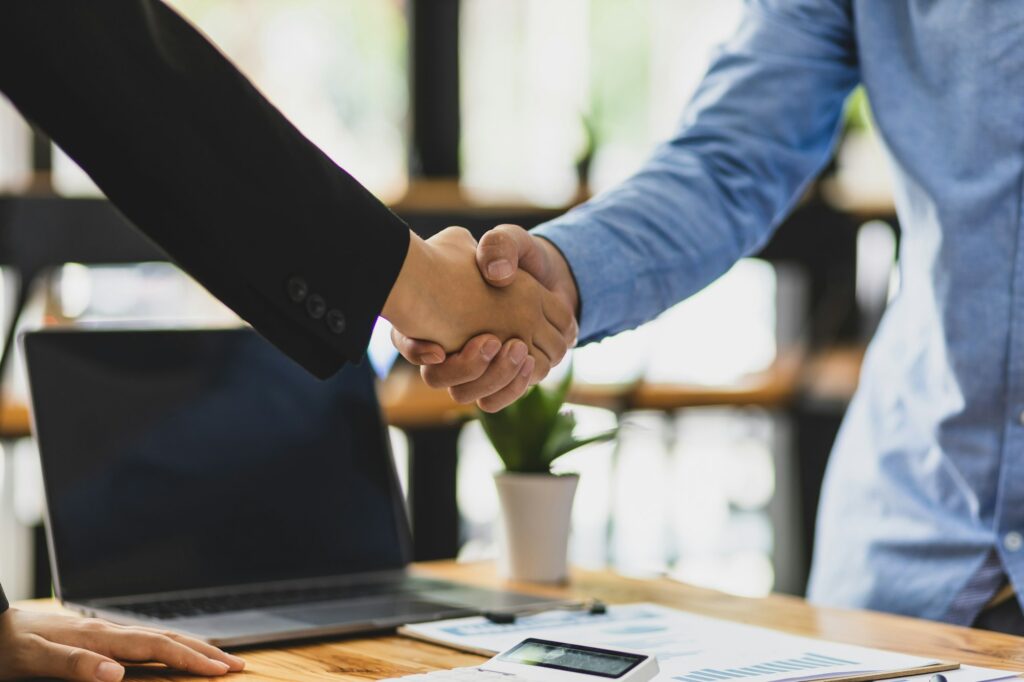 Handshake of business partners at a meeting.